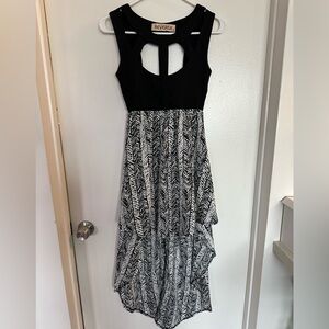 Black and white patterned dress. Short in the front. Long in the back. Size S